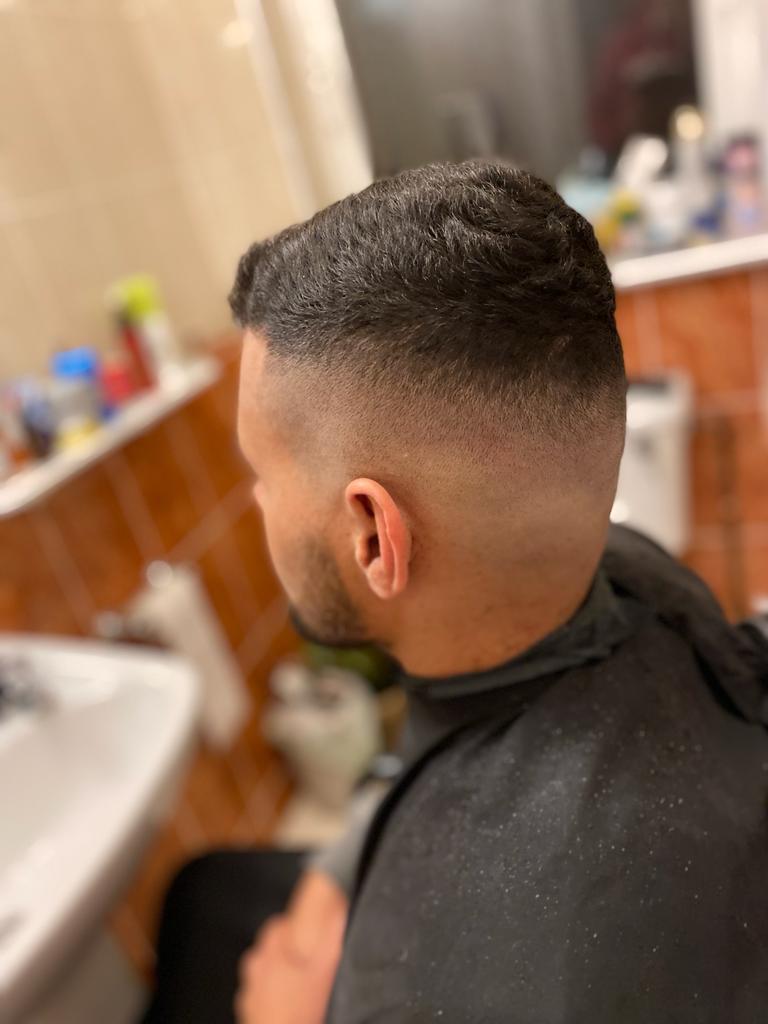 Man with a high fade looking good